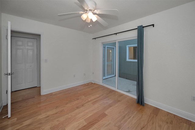 empty room with light hardwood / wood-style floors and ceiling fan