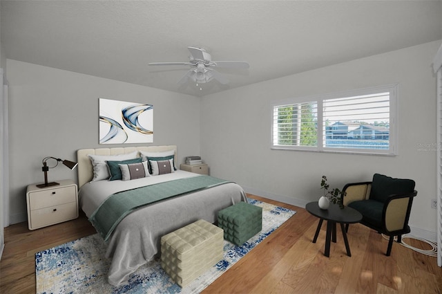 bedroom featuring ceiling fan and wood-type flooring