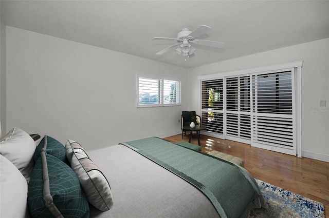 bedroom featuring hardwood / wood-style flooring and ceiling fan