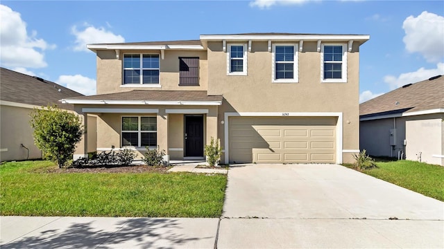 view of front of home featuring a garage and a front yard