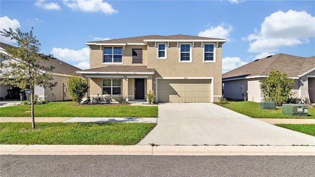 view of front property featuring a front yard, a garage, and cooling unit