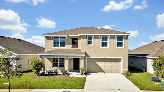 front of property with a front yard and a garage