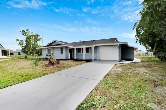 ranch-style home featuring a front lawn and a garage