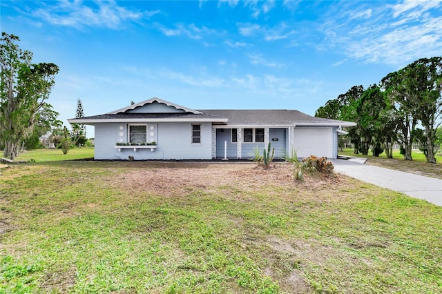 ranch-style house with a garage and a front yard