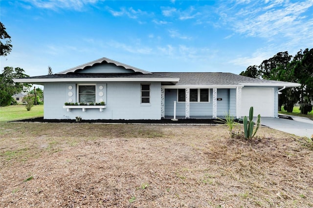 ranch-style home featuring a front yard and a garage