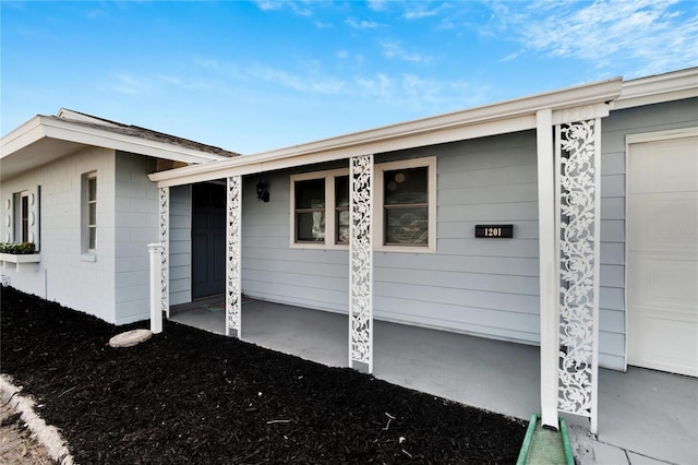 entrance to property with a porch