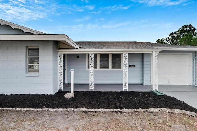 view of exterior entry with a garage