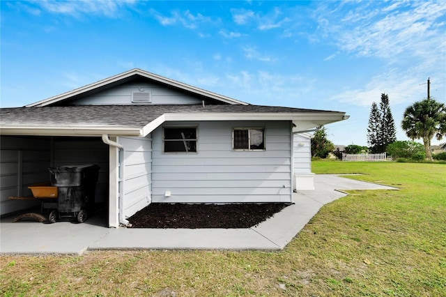 view of property exterior with a lawn