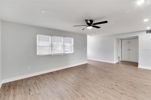 unfurnished room with ceiling fan and light hardwood / wood-style floors