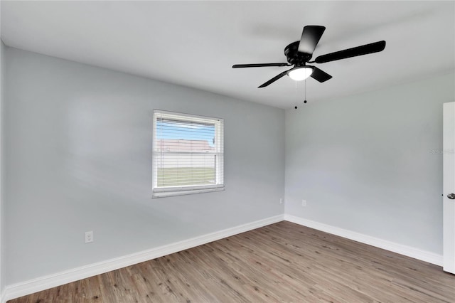 unfurnished room with light wood-type flooring and ceiling fan