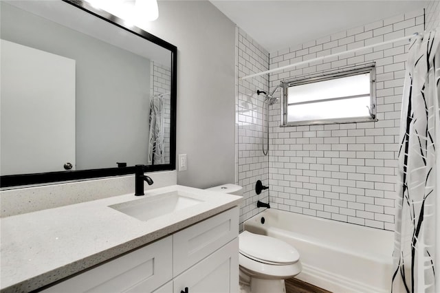full bath featuring shower / bath combination with curtain, toilet, and vanity