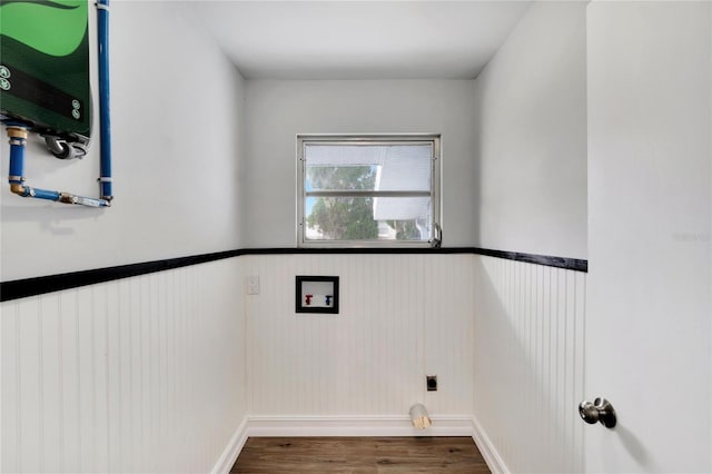 washroom with a wainscoted wall, washer hookup, wood finished floors, electric dryer hookup, and laundry area
