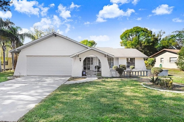 ranch-style home with covered porch, a front yard, and a garage