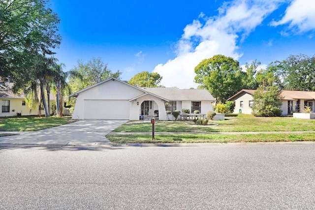 single story home with a garage and a front yard