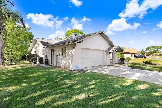 view of home's exterior featuring a lawn and a garage