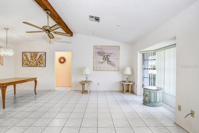 interior space featuring a textured ceiling, vaulted ceiling with beams, light tile patterned flooring, and ceiling fan with notable chandelier