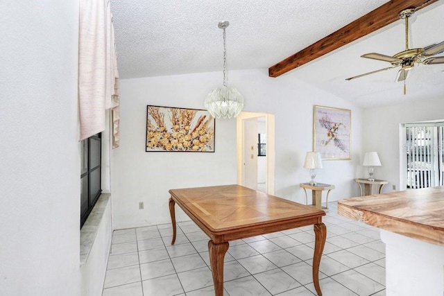 dining room with vaulted ceiling with beams, ceiling fan with notable chandelier, light tile patterned flooring, and a textured ceiling