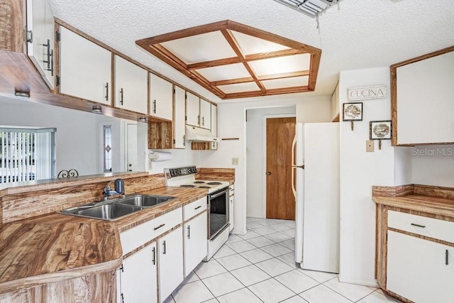 kitchen with custom exhaust hood, white appliances, white cabinets, sink, and a textured ceiling