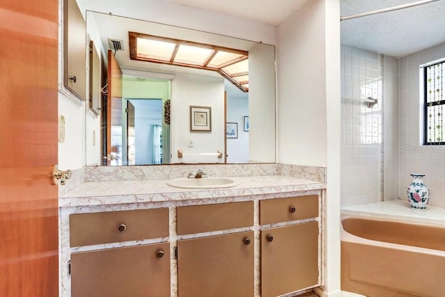 bathroom featuring shower with separate bathtub and vanity