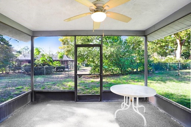 sunroom featuring a wealth of natural light and ceiling fan