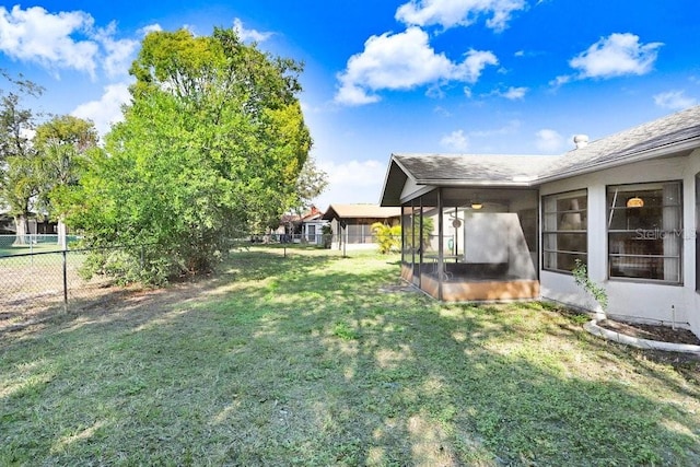 view of yard with a sunroom