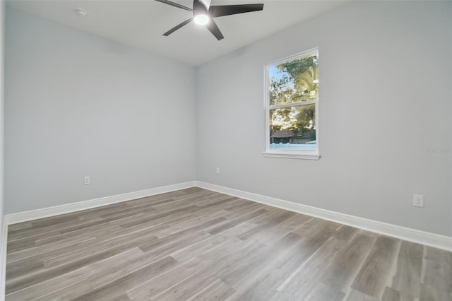 empty room featuring ceiling fan and light hardwood / wood-style floors