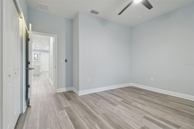 spare room with ceiling fan and light hardwood / wood-style floors