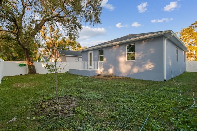 view of home's exterior with a lawn