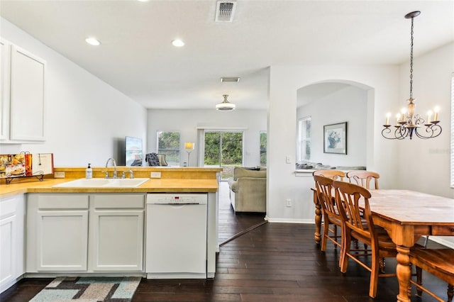 kitchen with white cabinetry, sink, white dishwasher, and pendant lighting