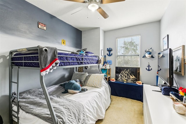 bedroom with light carpet and ceiling fan