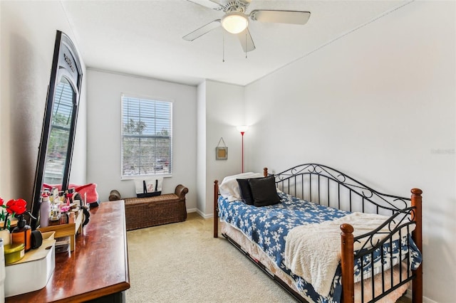 bedroom featuring ceiling fan and carpet floors