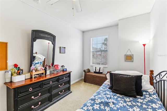 bedroom featuring ceiling fan and light colored carpet