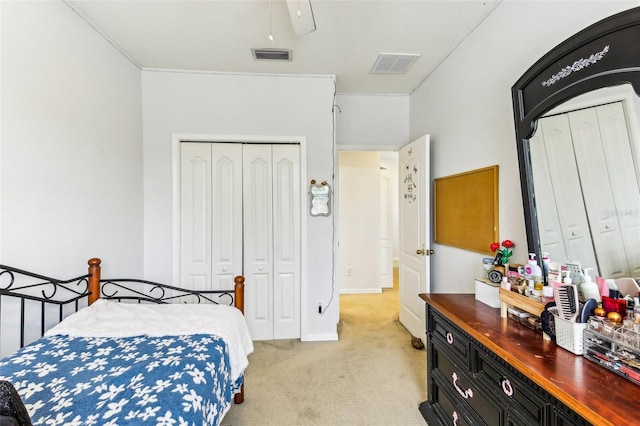 bedroom with light carpet, a closet, and ceiling fan