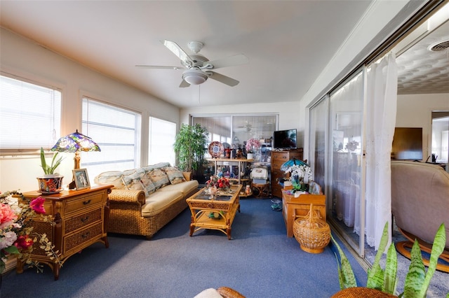 interior space with ceiling fan