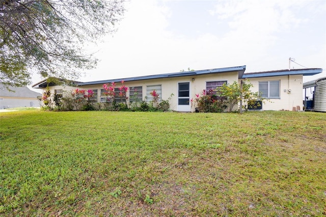 single story home with a front yard