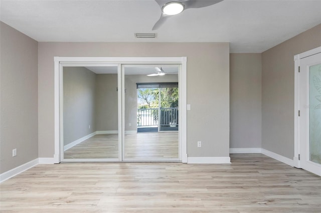 unfurnished room with light hardwood / wood-style floors and ceiling fan