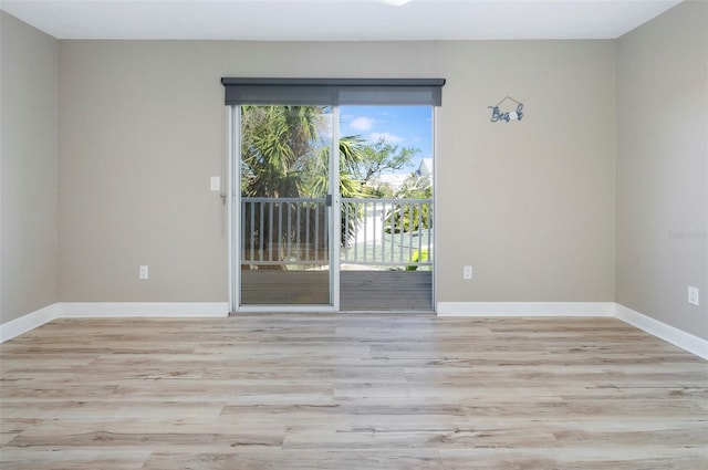 spare room featuring light wood-type flooring