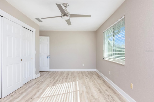 unfurnished bedroom with a closet, ceiling fan, and light hardwood / wood-style floors