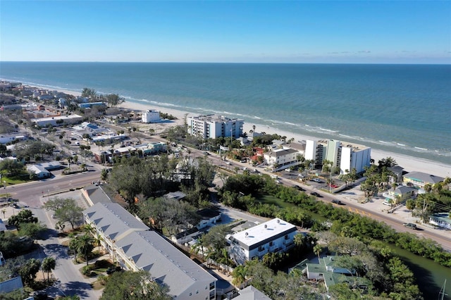 birds eye view of property featuring a beach view and a water view