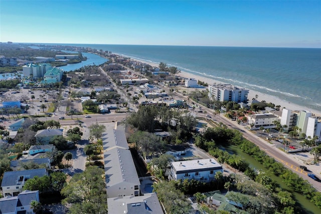 drone / aerial view with a water view and a beach view