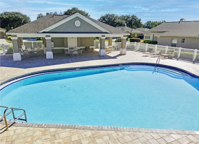 view of swimming pool featuring a patio area