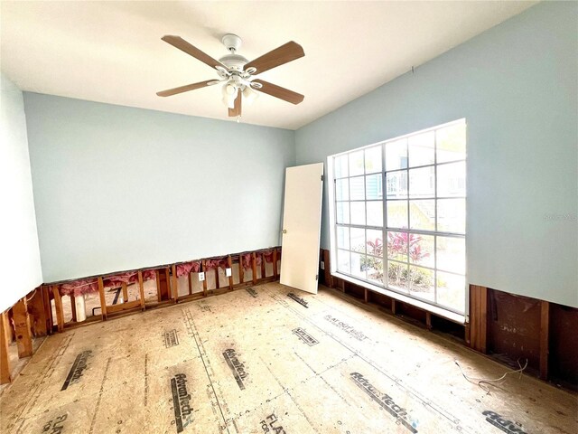 unfurnished room featuring a ceiling fan