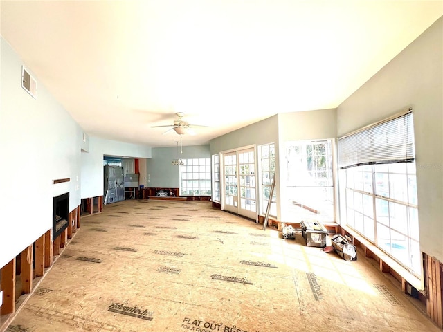 unfurnished living room featuring ceiling fan and visible vents