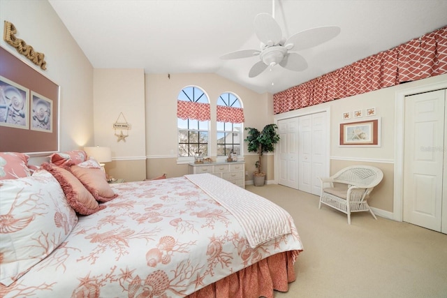 carpeted bedroom featuring ceiling fan and lofted ceiling