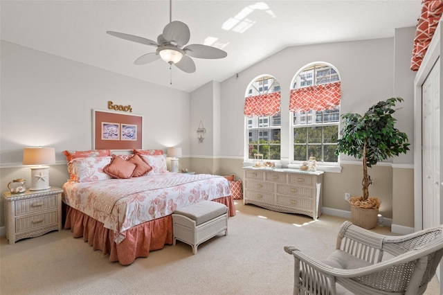 bedroom featuring ceiling fan, carpet flooring, a closet, and vaulted ceiling