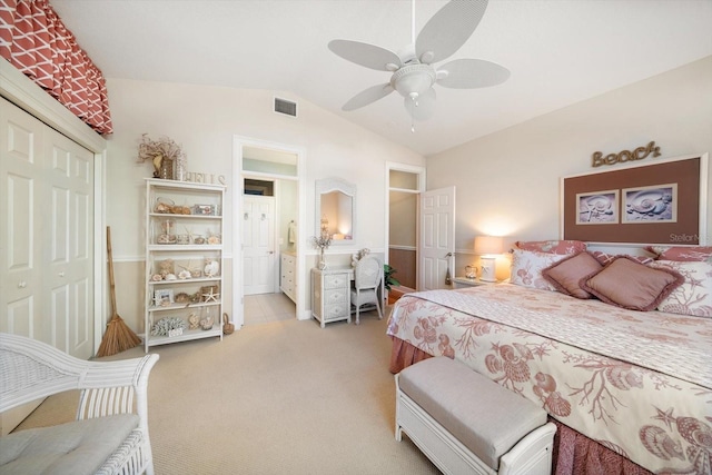 bedroom with ceiling fan, a closet, vaulted ceiling, and light carpet