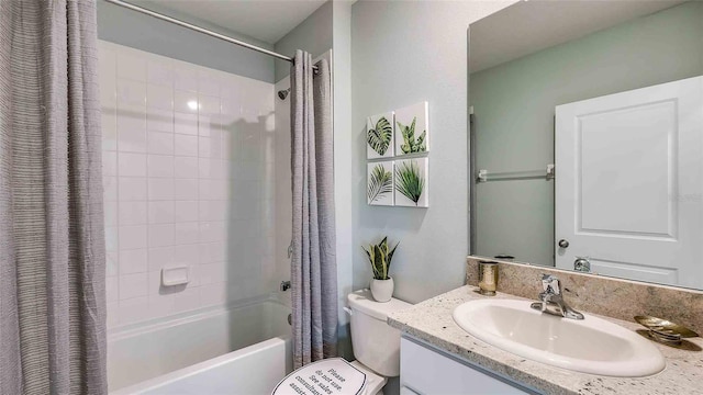 full bathroom with vanity, shower / bath combination with curtain, and toilet