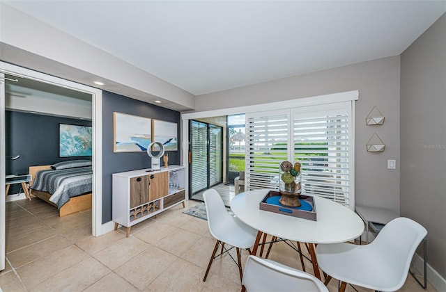 dining area featuring light tile patterned flooring