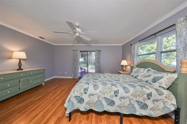 bedroom with ceiling fan, light hardwood / wood-style floors, a textured ceiling, access to outside, and ornamental molding