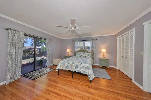 bedroom featuring crown molding, ceiling fan, access to exterior, light hardwood / wood-style floors, and a closet